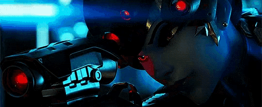 a woman is holding a gun in a dark room .