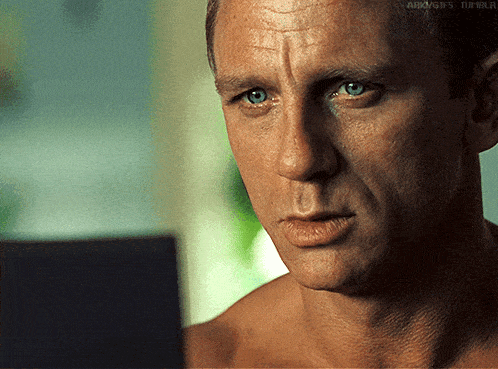 a close up of a man 's face with the words ark gifs tumblr on the bottom right