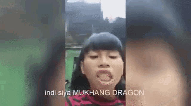 a girl is making a funny face with her mouth open and the words `` indi siya mukhang dragon '' .