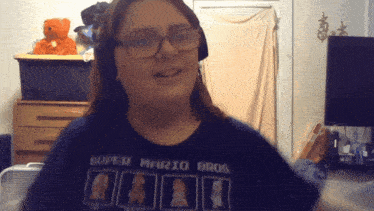 a girl wearing a super mario bros shirt