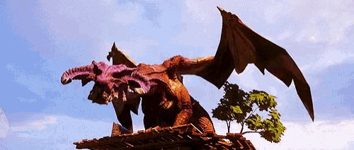 a dragon is sitting on top of a wooden structure