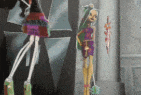 a monster high doll is standing next to a skeleton