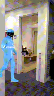 a man in a blue suit with the word veggie on the back