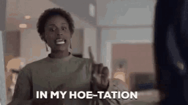 a woman is making a funny face and says `` in my hoe-tation '' while holding a knife .