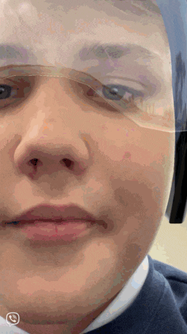 a close up of a person 's face wearing a safety goggles