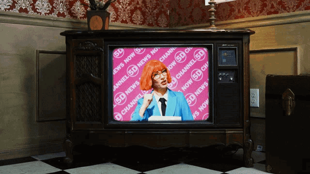 a sd news channel is being shown on a television