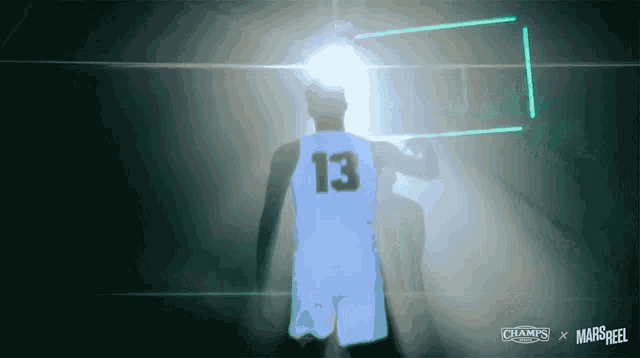 a basketball player with the number 13 on the back of his shirt
