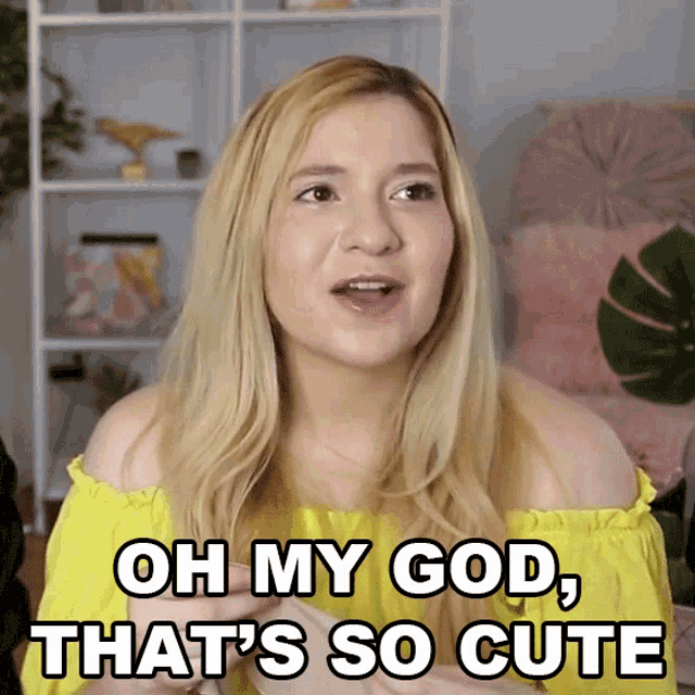 a woman in a yellow off the shoulder top is saying oh my god that 's so cute