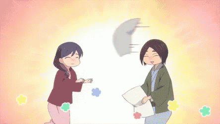 a couple of anime characters are standing next to each other holding a piece of paper .
