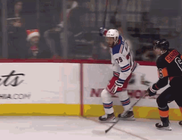 a hockey player with the number 79 on his jersey is skating on the ice