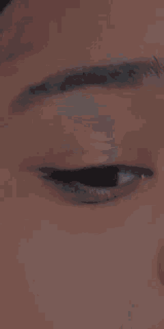 a close up of a person 's eye shows the pupil and iris