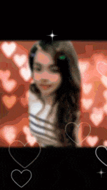 a blurry picture of a girl with hearts surrounding her