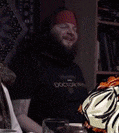 a man with a beard is wearing a black shirt that says doc