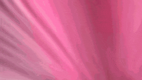 a blurred image of a person flying through the air on a pink and black background .