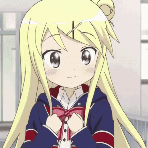 a girl with blonde hair is wearing a blue and red jacket