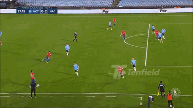 a soccer game is being played on a field with an ad for tentfield in the background