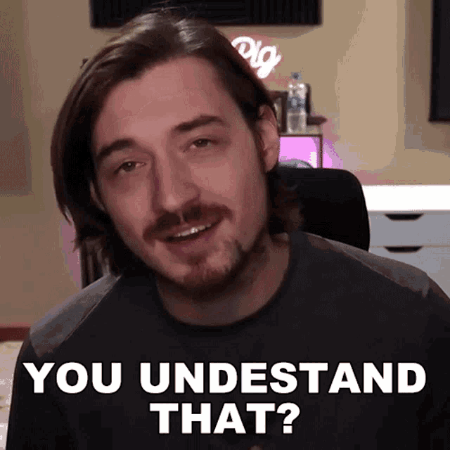 a man with long hair and a beard is asking if he understands that