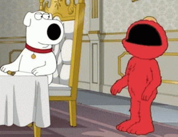 elmo is standing in front of a white dog