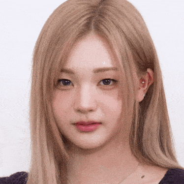 a close up of a woman with blonde hair