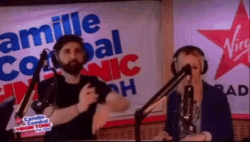 a man and a woman are dancing in front of a sign that says camille combat virgin tonic