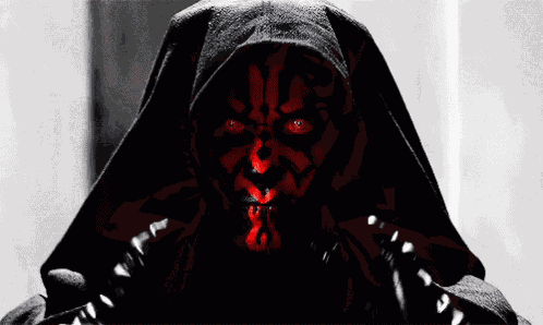 a black and white photo of a man with a red face