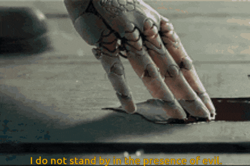 a close up of a robotic hand with the words " i do not stand by in the presence of evil "
