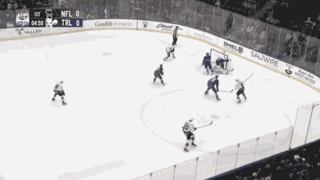 a hockey game is being played in a stadium sponsored by shell and saltwire