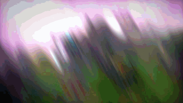 a purple and green background with a blurred image