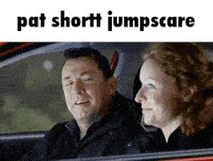 a man and woman are sitting in a car with pat shortt jumpscare written on the bottom