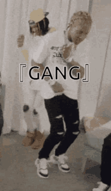 a group of people are dancing in a room with the word gang written on the bottom