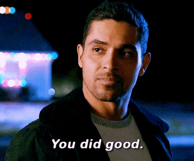 a man says " you did good " in front of a carnival