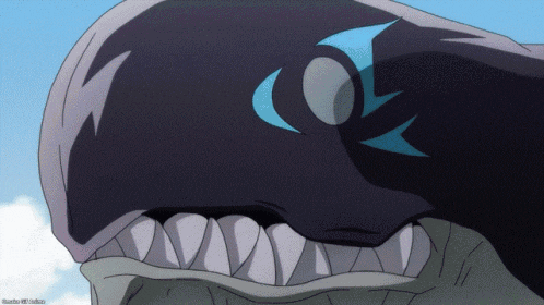 a close up of a whale 's head with a blue eye and teeth
