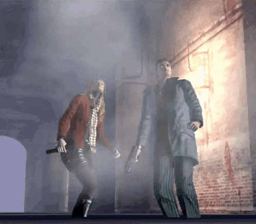 a man and a woman are standing in a dark room