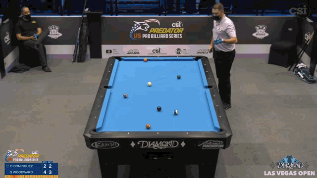 a pool table with a diamond logo on the top