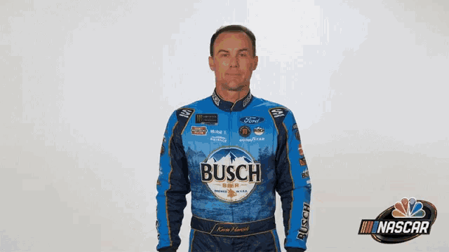 a man in a busch shirt is saying sorry .