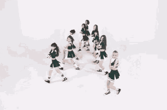 a group of cheerleaders are dancing in front of a welcome buck message