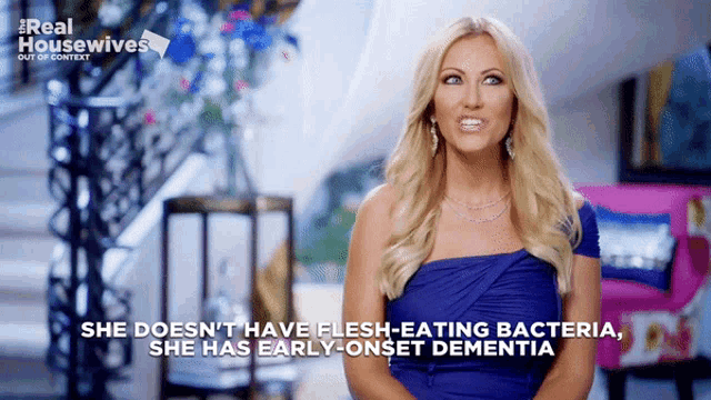 a woman in a blue dress says she doesn 't have flesh-eating bacteria she has early onset dementia