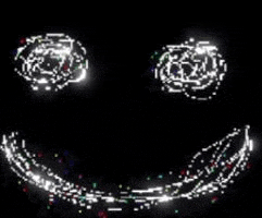 a glowing smiley face made of dots on a black background