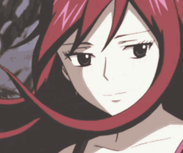 a close up of a woman 's face with red hair