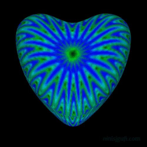 a heart shaped object with a green and blue pattern on a black background