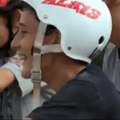 a man wearing a white helmet with a red sticker that says always