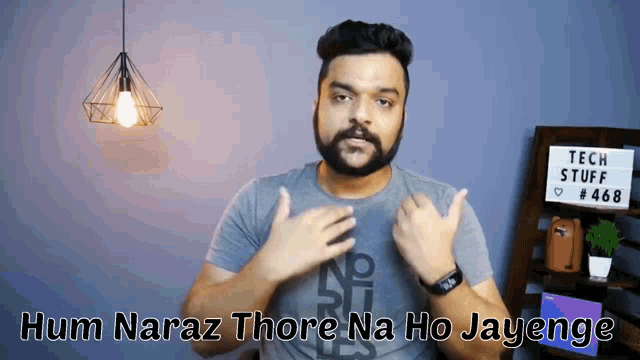 a man with a beard says hum naraz thore na ho jayenge in front of a sign that says tech stuff # 468