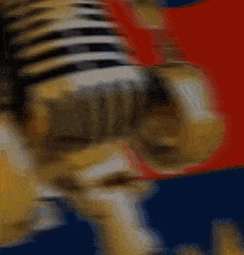 a blurred image of a microphone with the word t.m.m. on it