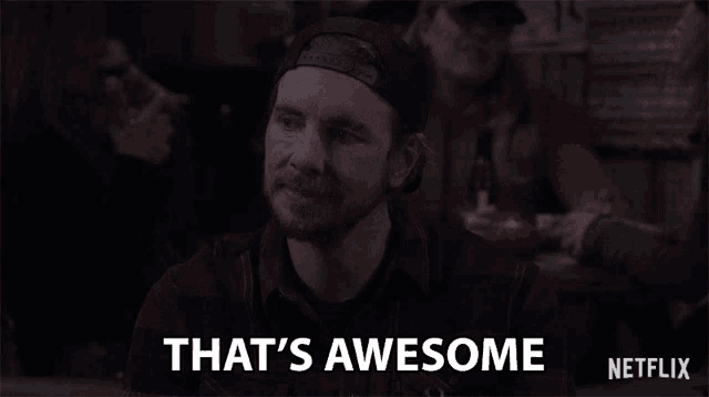 a man in a hat is saying that 's awesome
