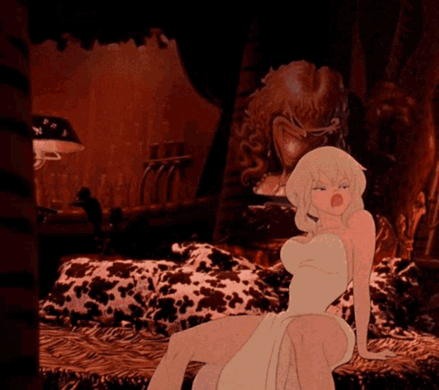 a woman in a white dress is sitting on a bed
