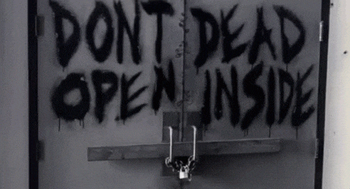 a door with the words " do n't dead open inside " written on it