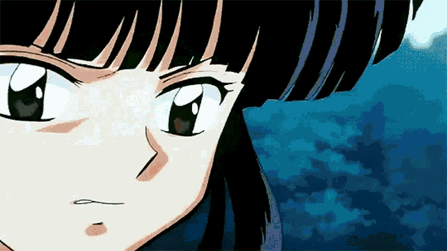 a close up of a cartoon character 's face with a blue background .