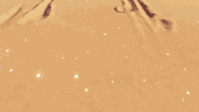 a man and a woman are walking through the desert