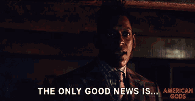 a man in a plaid suit and tie says the only good news is american gods