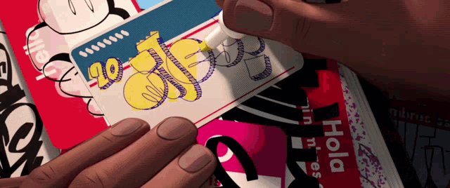 a person is holding a card that says hola